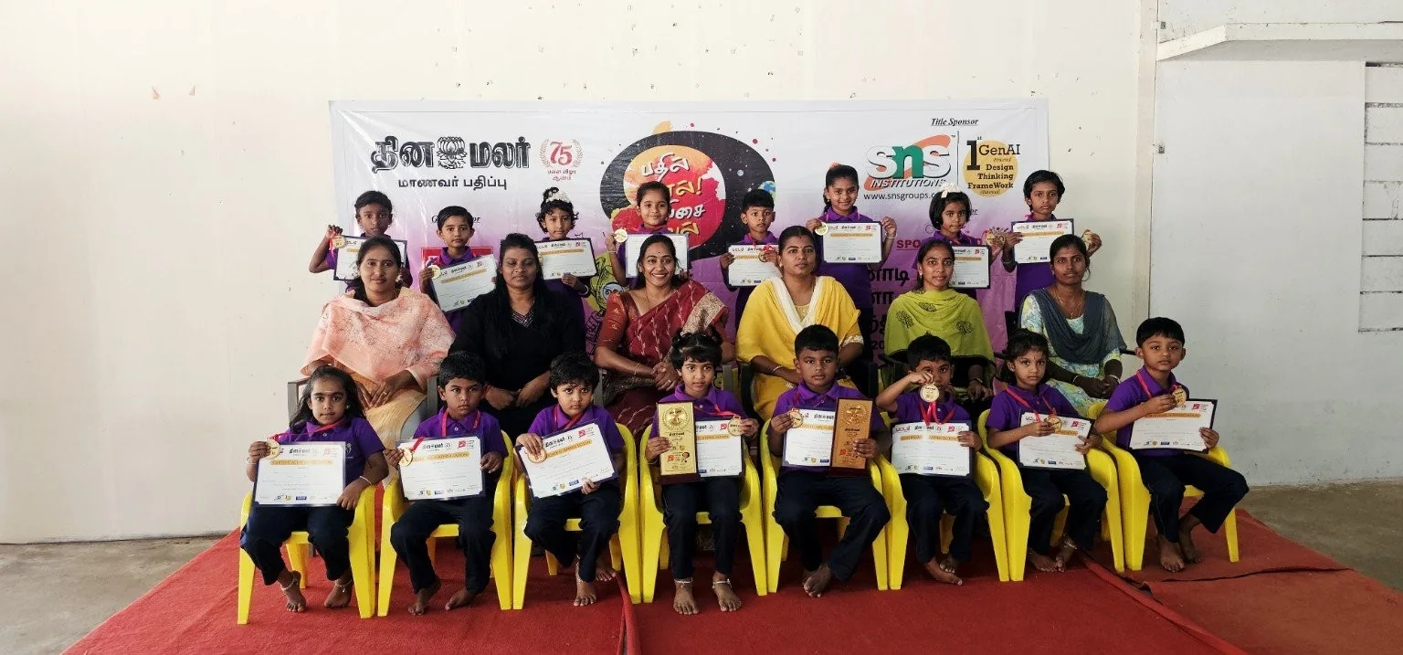 Purple Dots students holding certificates and awards
