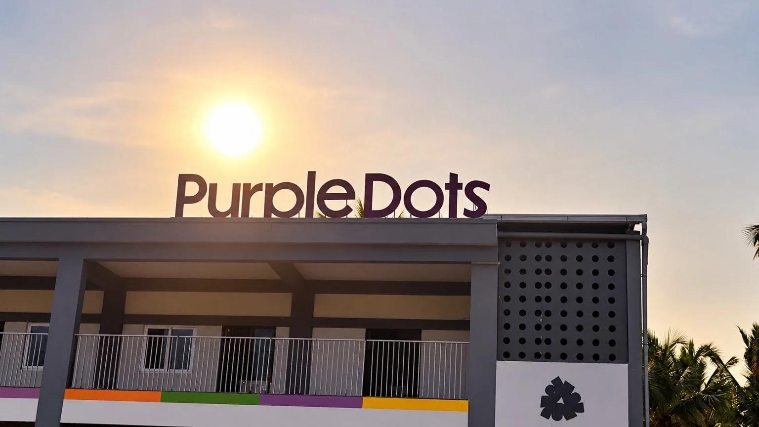 Purple Dots School campus building with school name